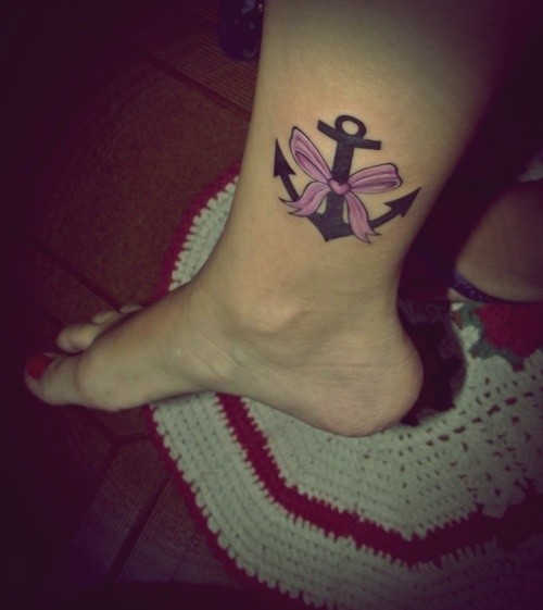 Black Anchor With Pink Bow Tattoo On Girl Right Leg