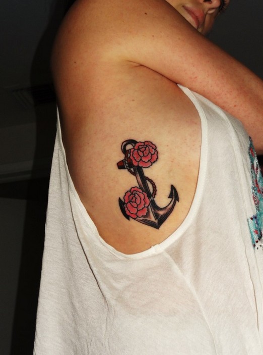 Black Anchor With Red Roses Tattoo On Women Right Side Rib