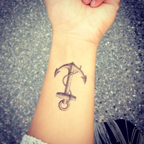 Black And Grey Anchor Tattoo On Girl Left Wrist