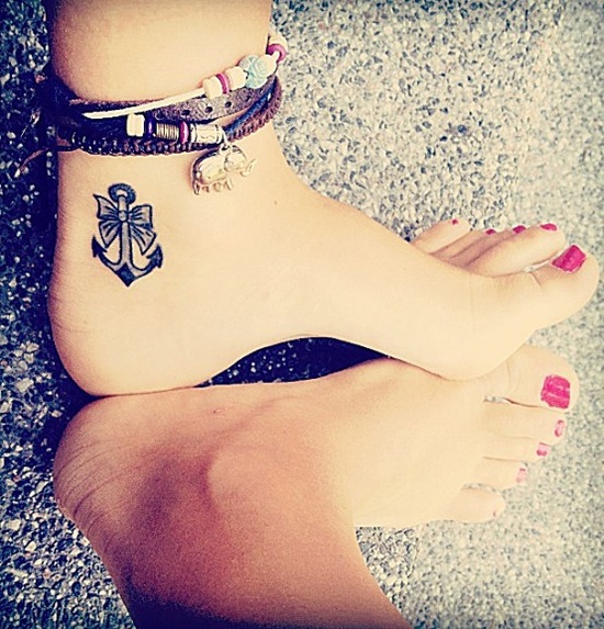 Black And Grey Anchor With Bow Tattoo On Women Left Ankle
