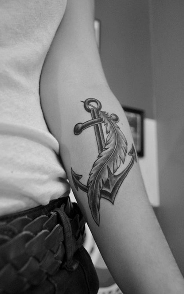 Black And Grey Anchor With Feather Tattoo On Left Forearm