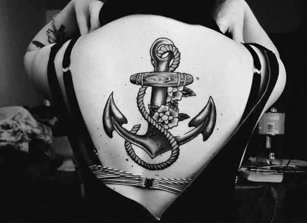 Black And Grey Anchor With Flowers Tattoo On Girl Upper Back