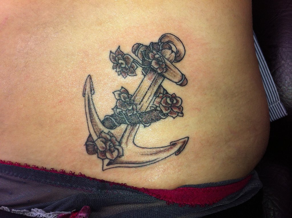 Black And Grey Anchor With Roses Tattoo Design For Lower Back By RoxenaBernardi