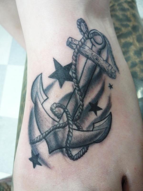 Black And Grey Anchor With Stars Tattoo On Left Foot