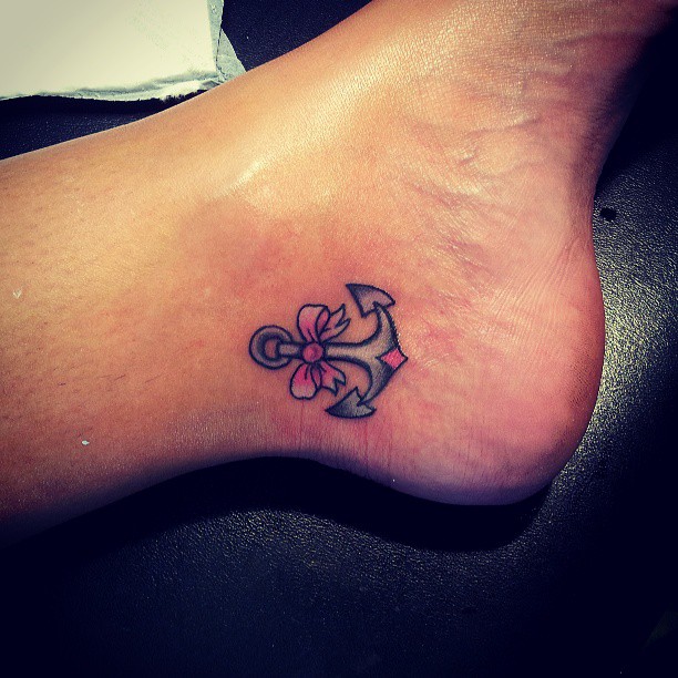 Black And Pink Anchor Tattoo On Left Heel