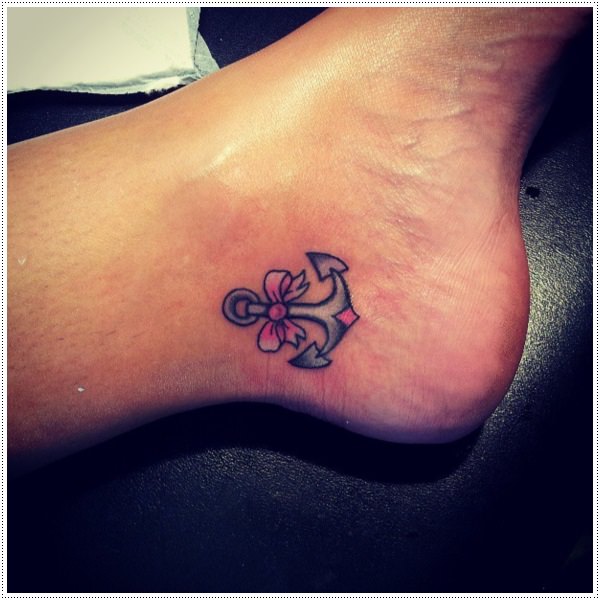 Black And Pink Anchor With Bow Tattoo On Left Ankle