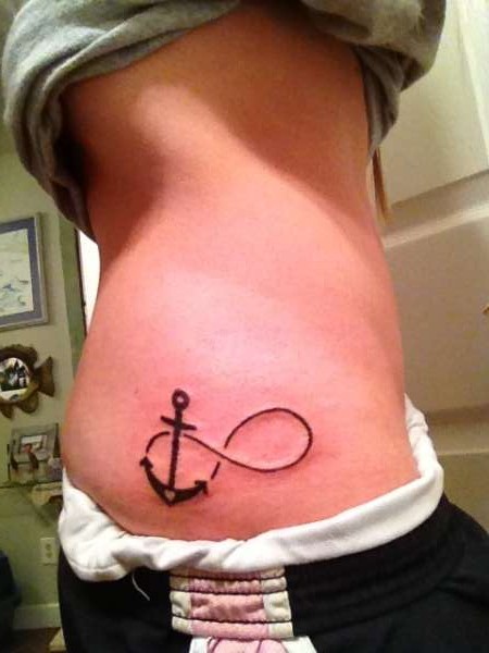 Black Infinity With Anchor Tattoo On Girl Right Hip