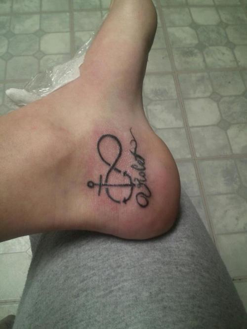 Black Infinity With Anchor Tattoo On Left Foot Ankle