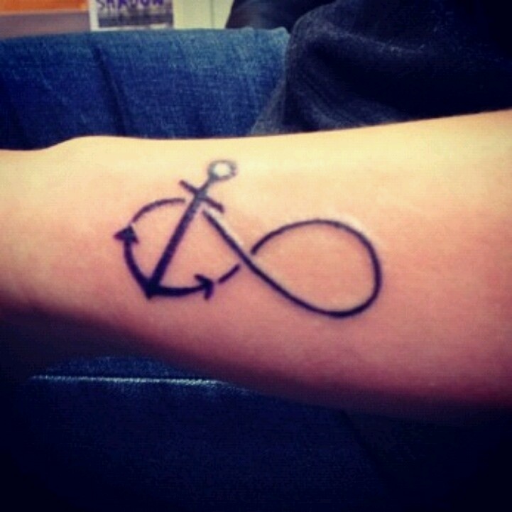 Black Infinity With Anchor Tattoo On Left Forearm