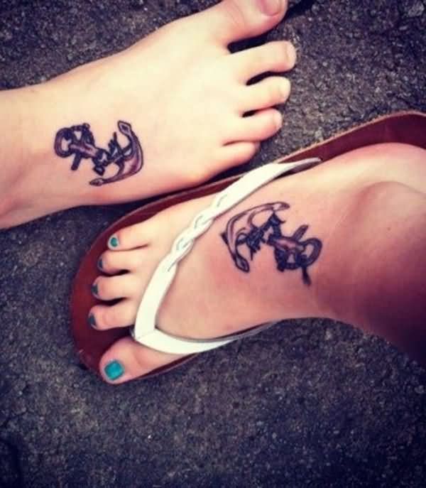 Black Ink Anchor Tattoo On Couple Left Foot