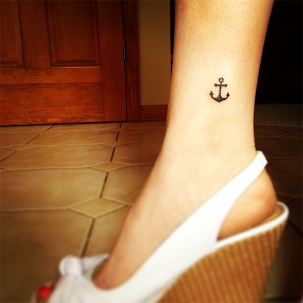 Black Ink Anchor Tattoo On Girl Left Ankle