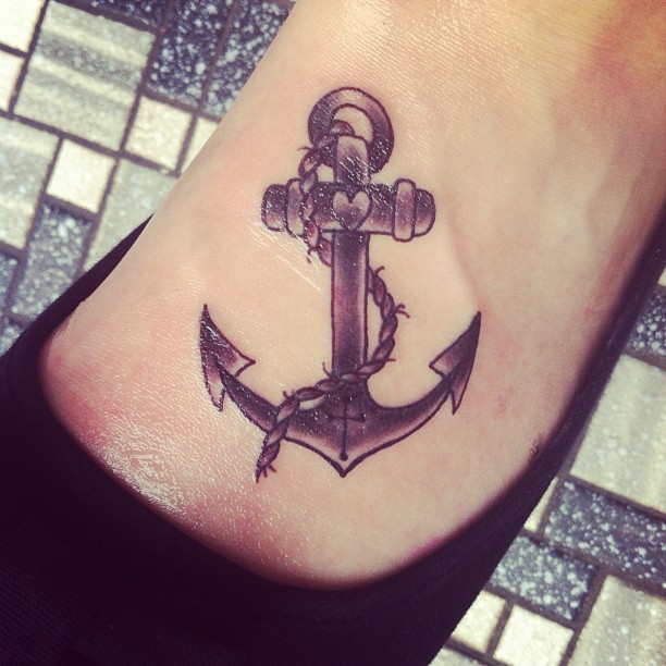Black Ink Anchor Tattoo On Girl Left Foot