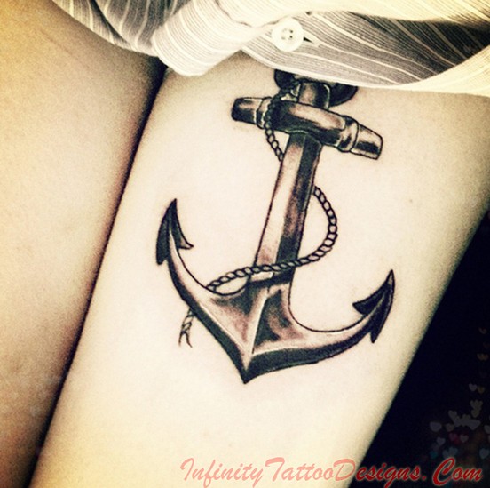 Black Ink Anchor Tattoo On Girl Left Thigh
