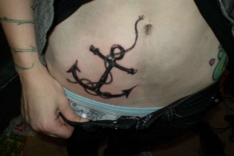 Black Ink Anchor Tattoo On Girl Right Hip