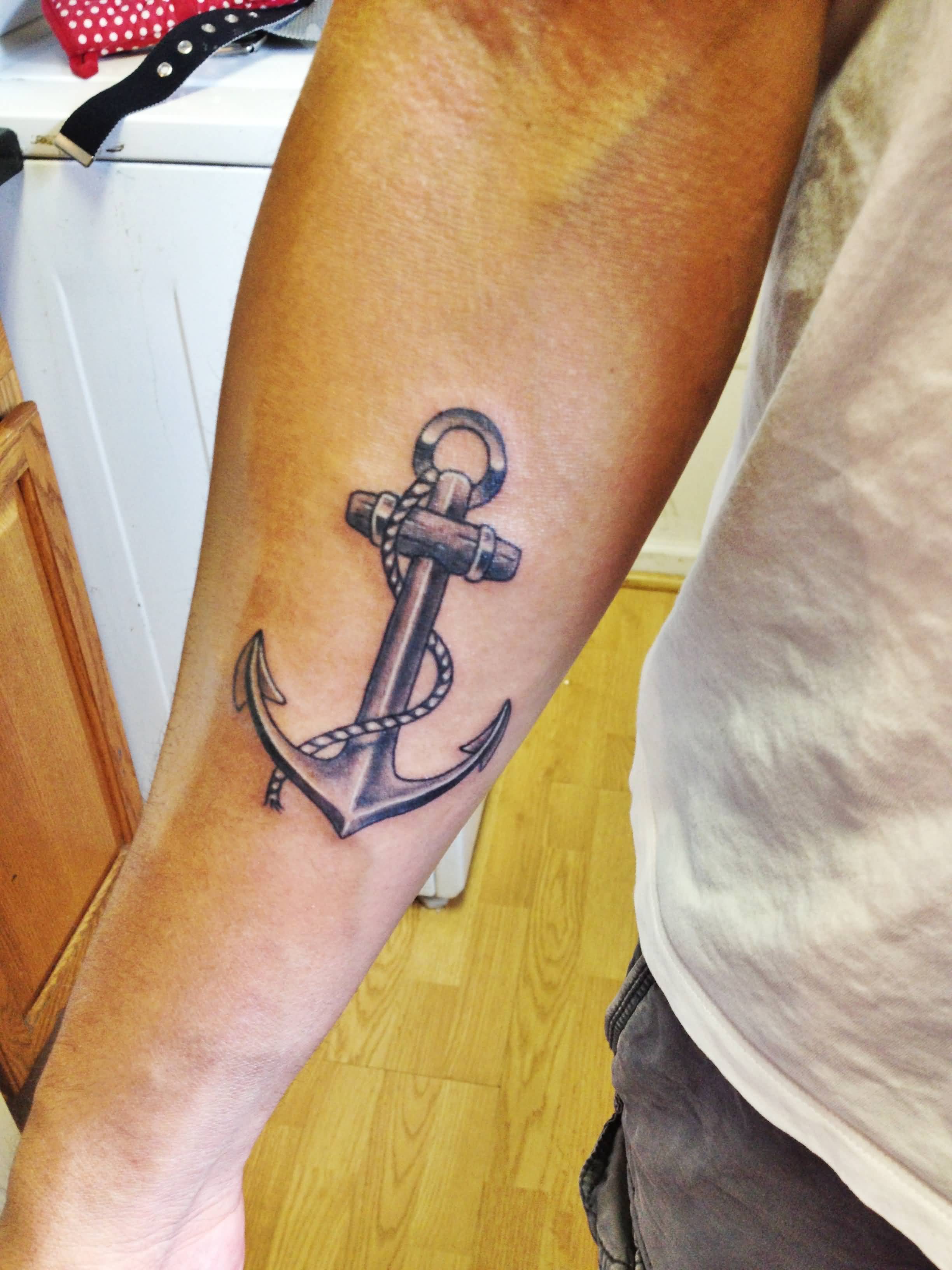 Black Ink Anchor Tattoo On Left Forearm
