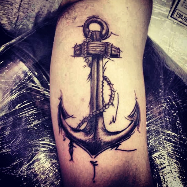 Black Ink Anchor Tattoo On Man Left Bicep
