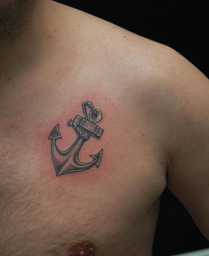 Black Ink Anchor Tattoo On Man Left Chest
