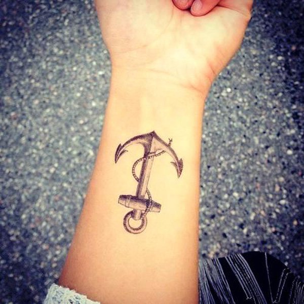 Black Ink Anchor Tattoo On Women Left Wrist