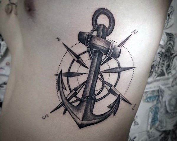 Black Ink Anchor With Compass Tattoo On Man Left Side Rib