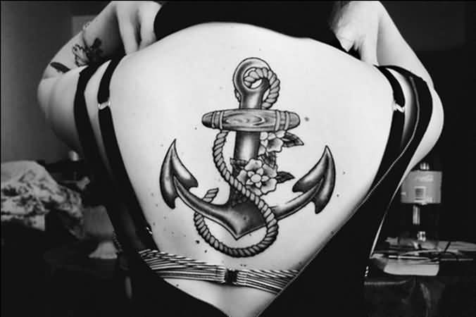Black Ink Anchor With Flowers Tattoo On Upper Back