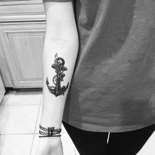 Black Ink Anchor With Flowers Tattoo On Women Right Forearm