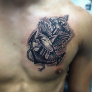 Black Ink Anchor With Flying Bird Tattoo On Man Left Chest