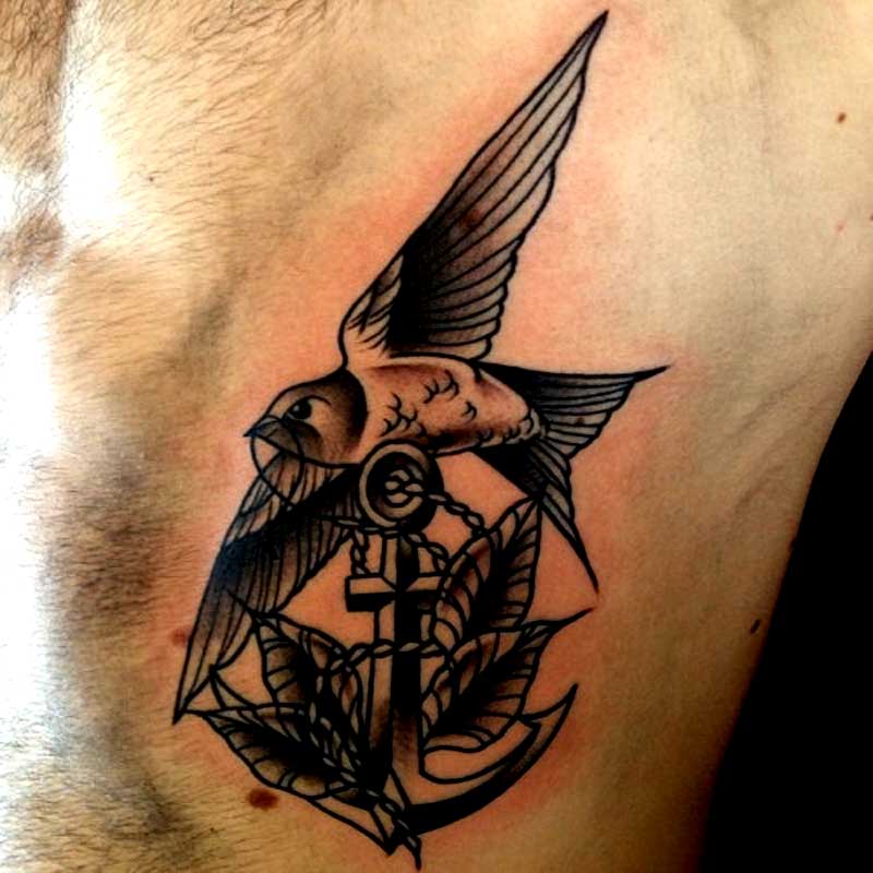 Black Ink Anchor With Flying Bird Tattoo On Man Left Side Rib