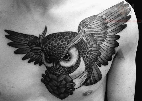 Black Ink Flying Owl With Geometric Heart Tattoo On Man Chest
