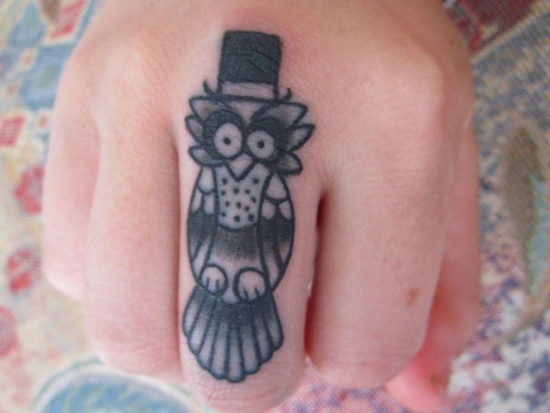 Black Ink Hat On Owl Tattoo On Right Hand Finger