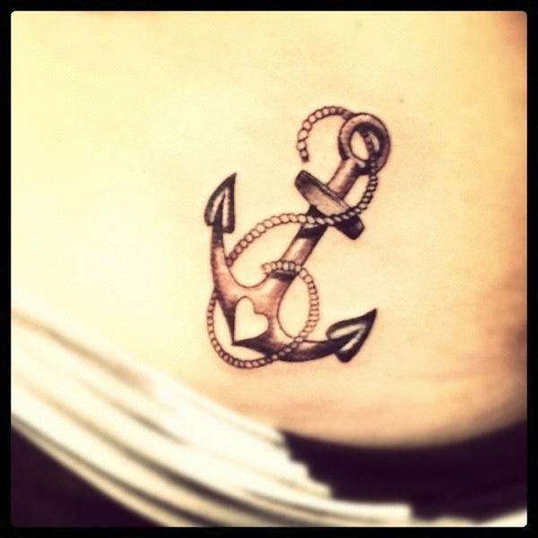 Black Ink Heart Shape In Anchor With Rope Tattoo Design For Hip
