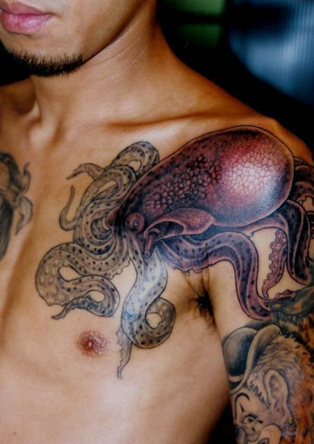 Black Ink Japanese Octopus Tattoo On Man Left Front Shoulder