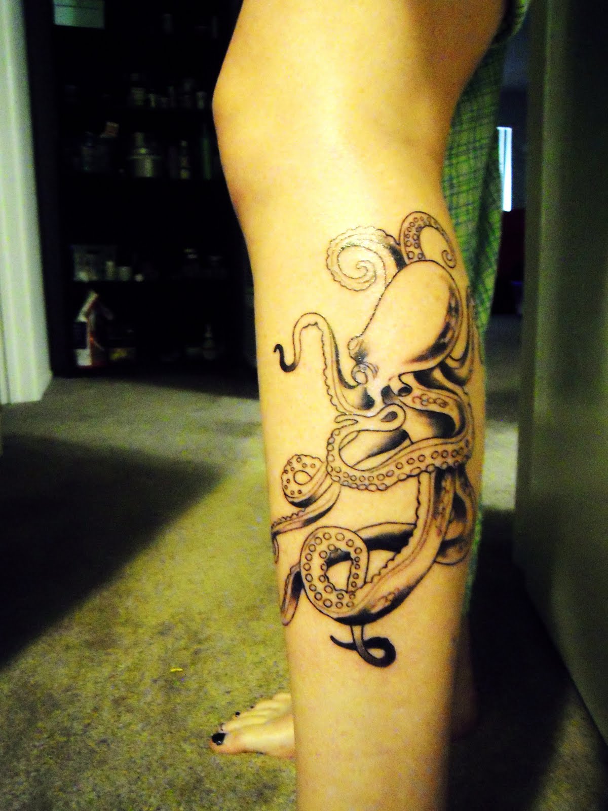 Black Ink Octopus Tattoo On Girl Left Leg Calf