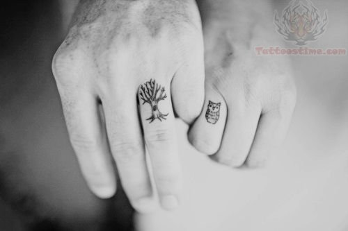 Black Ink Owl And Tree Without Leaves Tattoo On Couple Finger