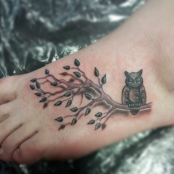 Black Ink Owl On Branch Tattoo On Left Foot