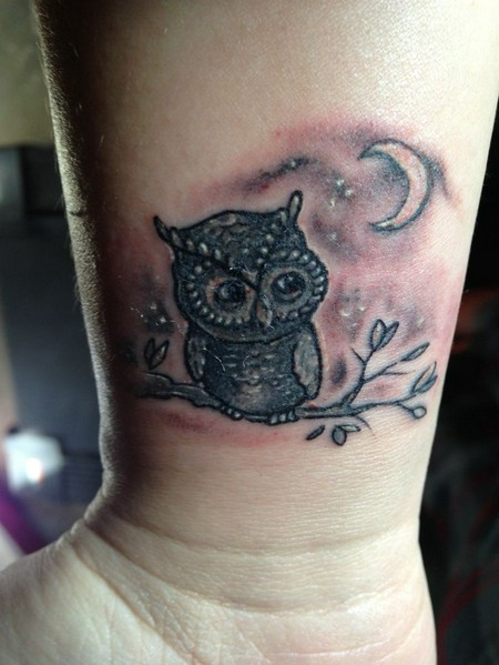 Black Ink Owl On Branch With Half Moon Tattoo Design For Wrist