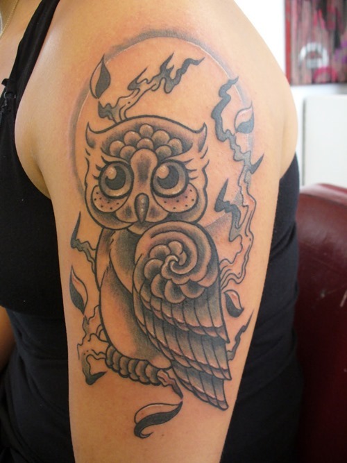 Black Ink Owl Tattoo On Female Left Shoulder