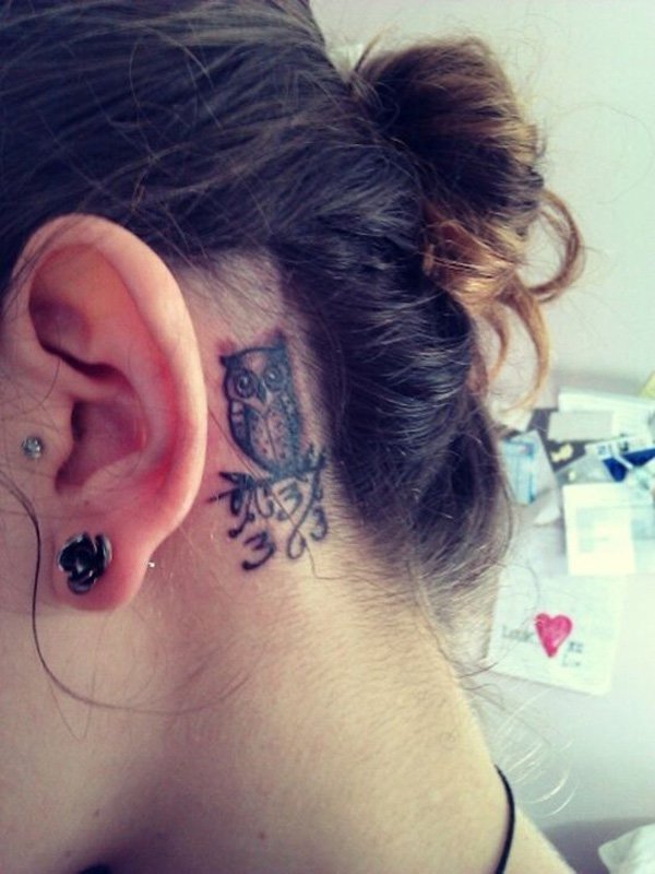 Black Ink Owl Tattoo On Girl Left Behind The Ear