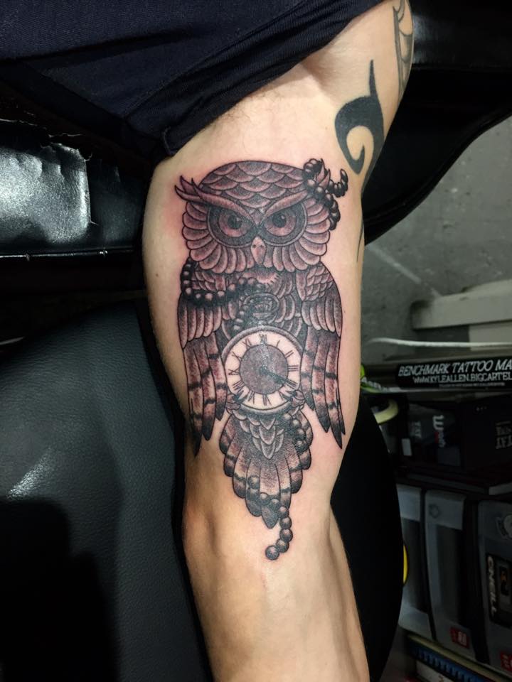 Black Ink Owl With Clock Tattoo On Left Bicep