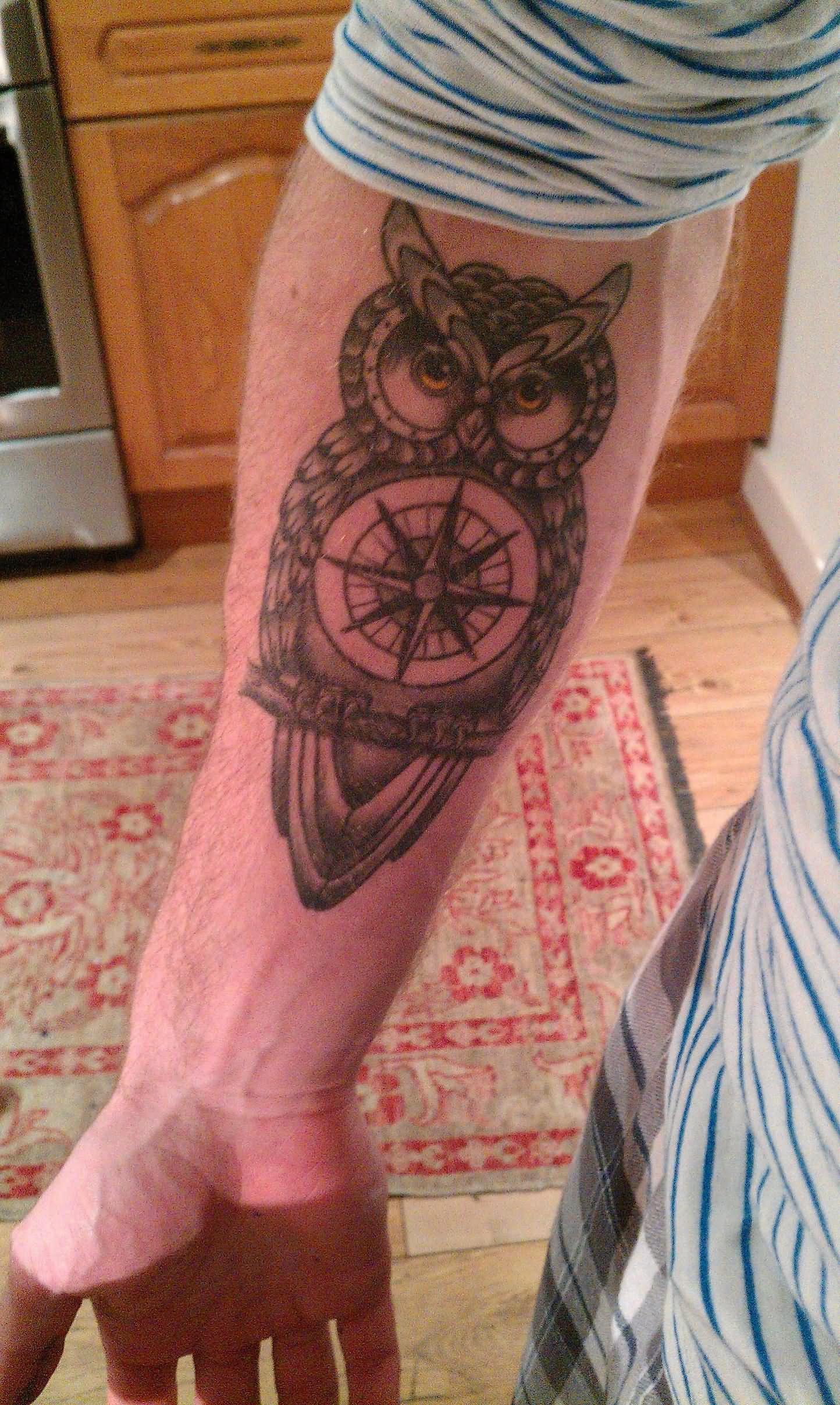 Black Ink Owl With Compass Tattoo On Right Forearm
