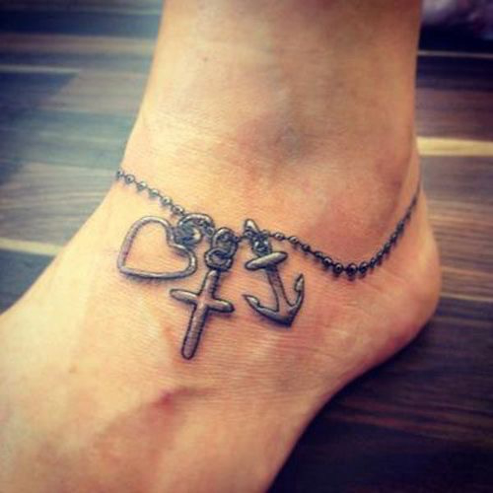 Black Ink Rosary Heart With Cross And Anchor Tattoo On Foot