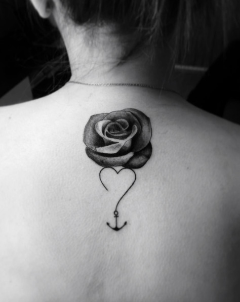 Black Ink Rose With Anchor Tattoo On Girl Upper Back By Matias Torres