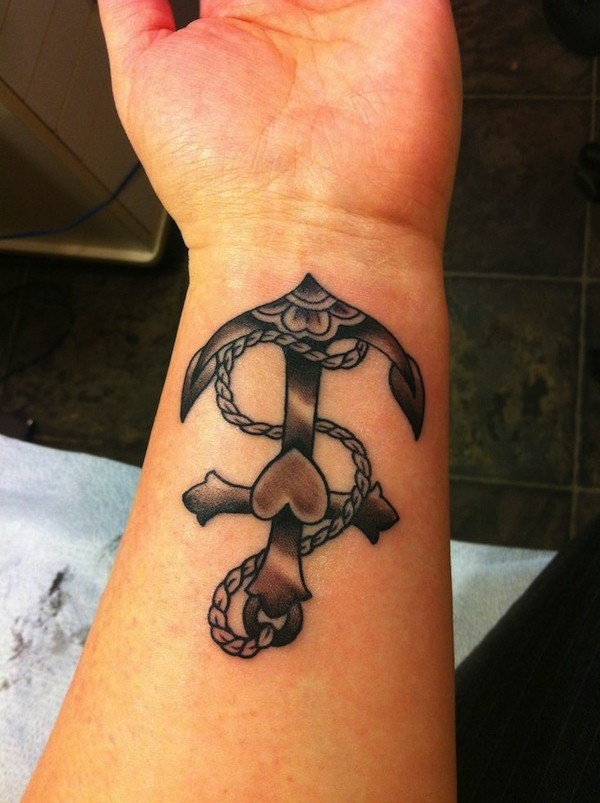 Black Ink Traditional Anchor Tattoo On Left Wrist