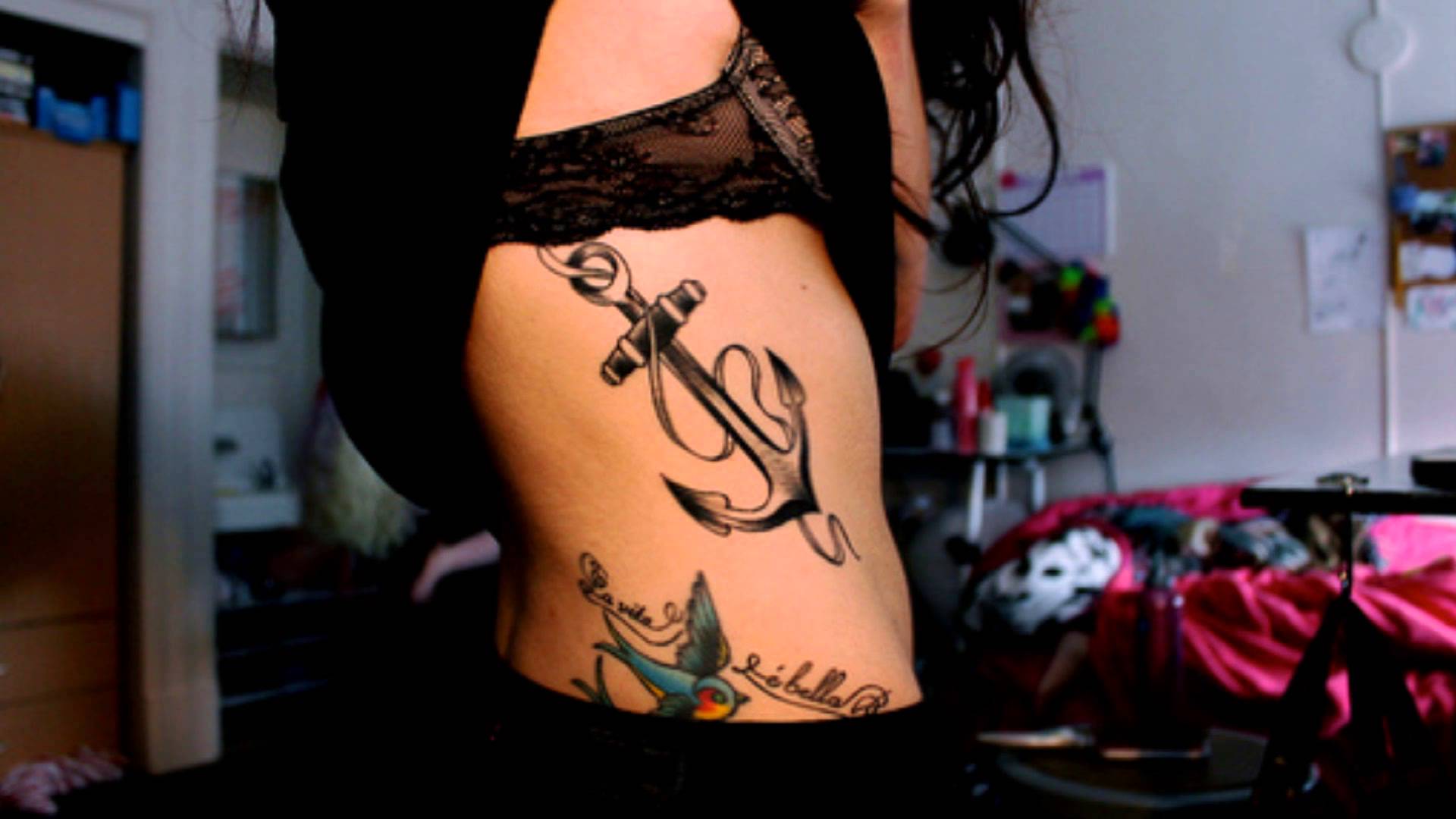 Black Ink Tribal Anchor Tattoo On Girl Right Side Rib
