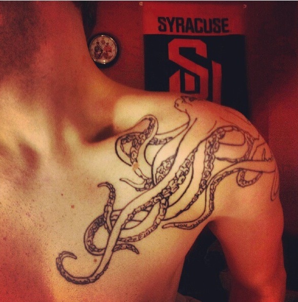 Black Outline Octopus Tattoo On Man Left Front Shoulder