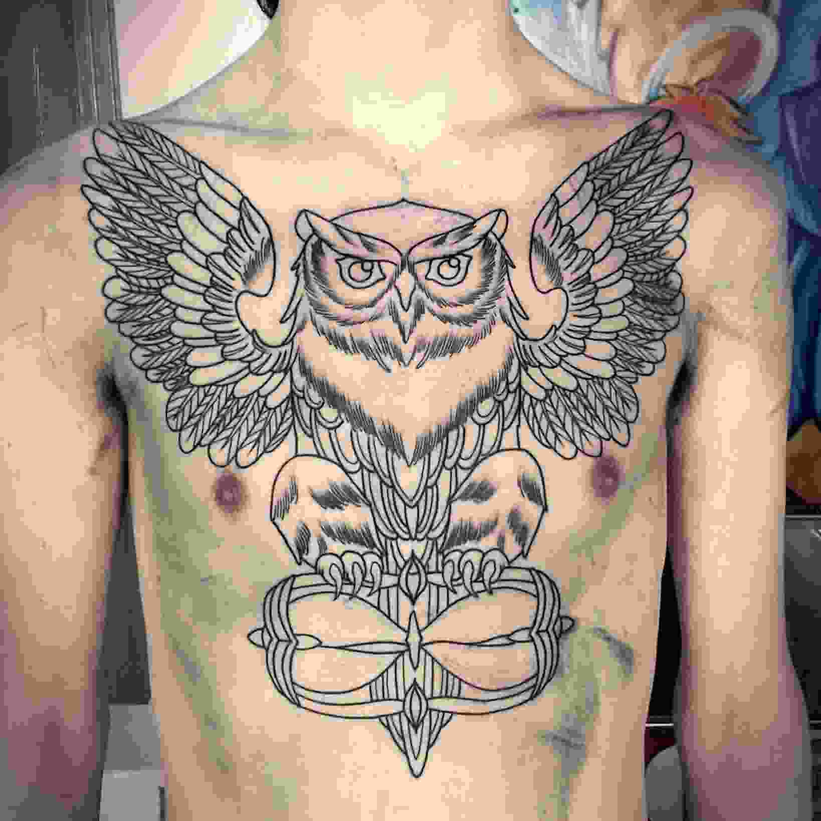 Black Outline Owl With Hourglass Tattoo On Man Chest