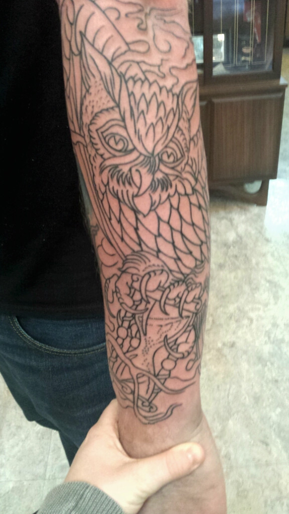 Black Outline Owl With Hourglass Tattoo On Right Arm By Jason Kelly