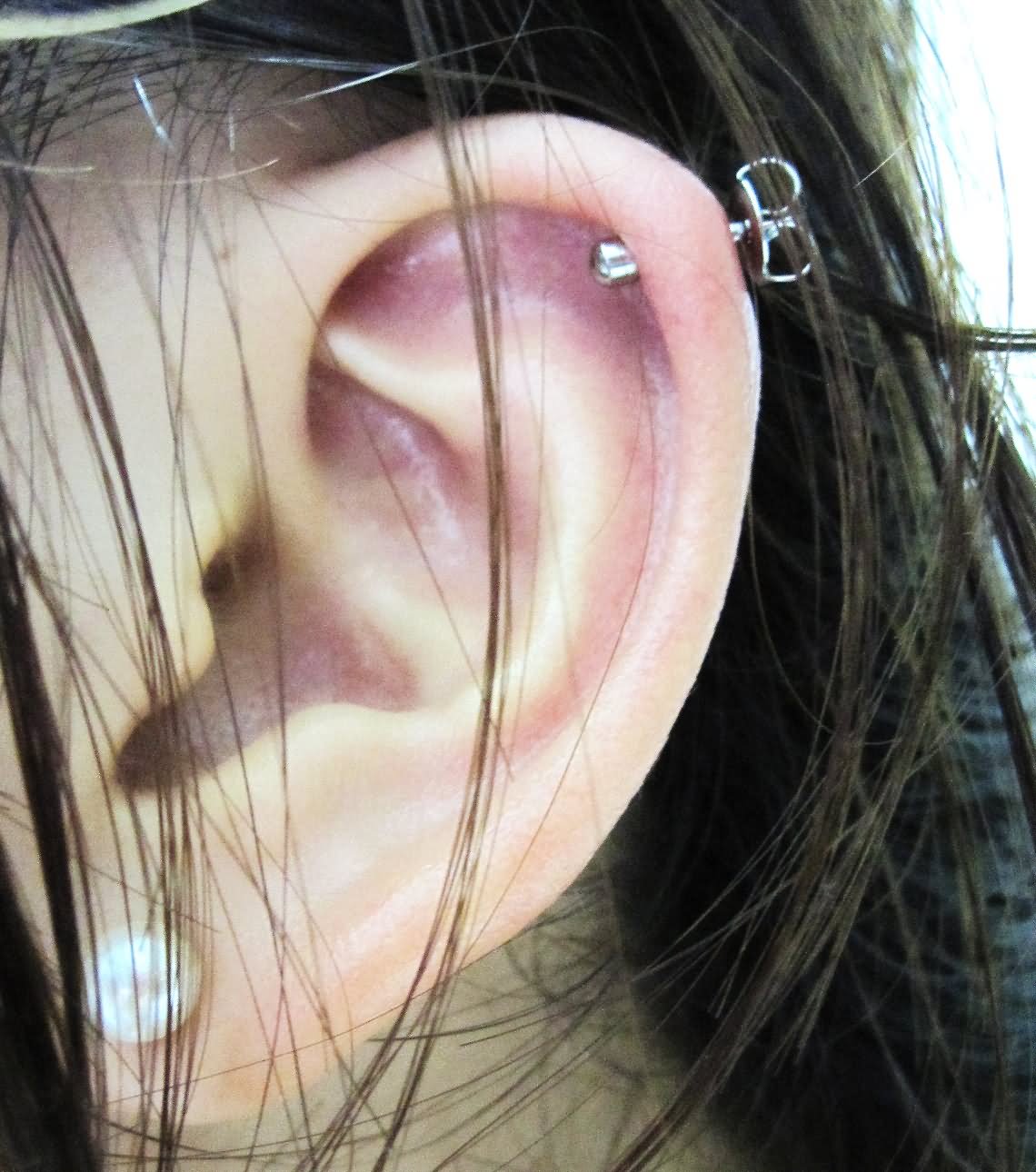 Cartilage Piercing On Girl Left Ear Lobe