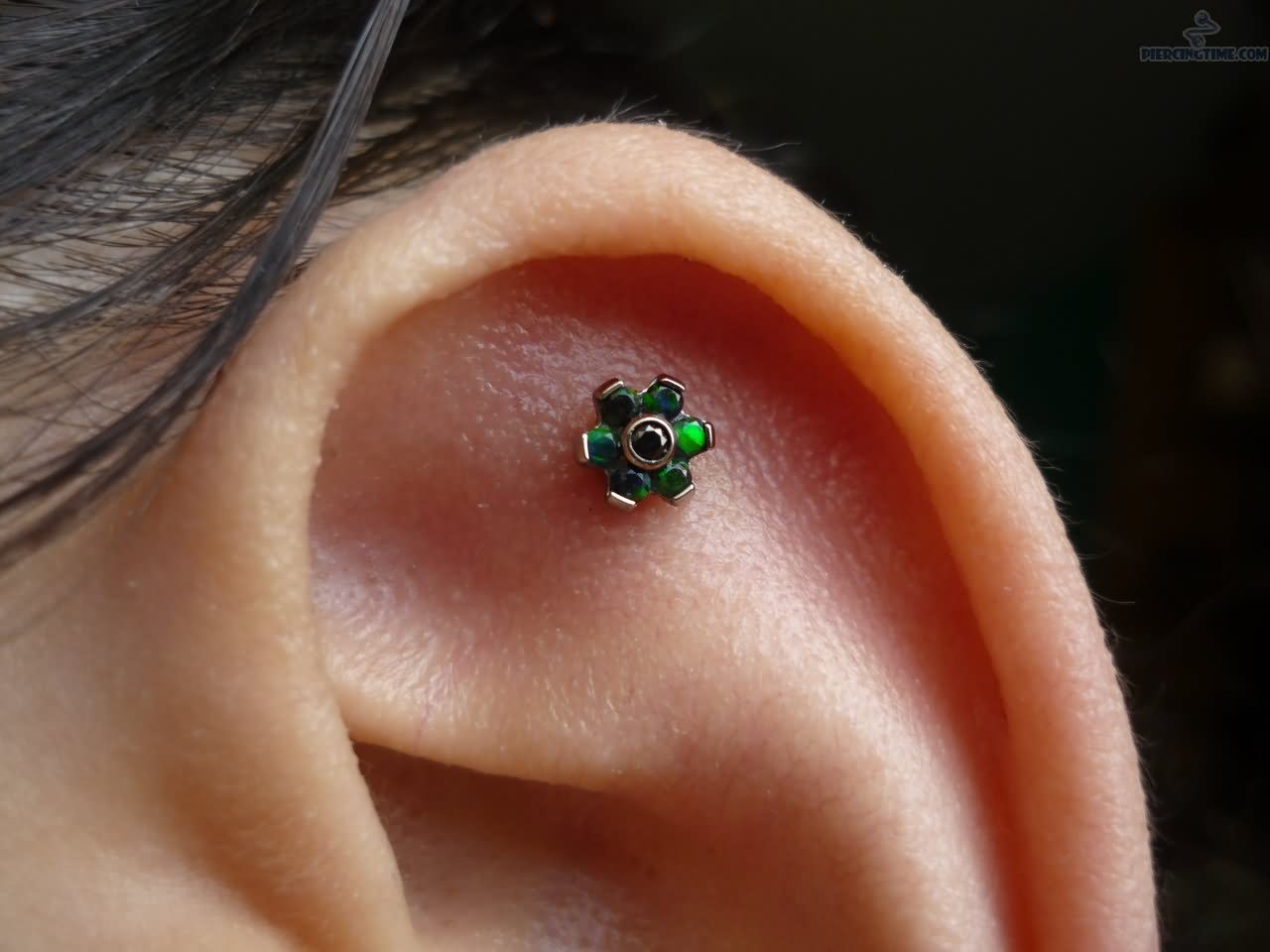 Cartilage Piercing With Green Flower Stud