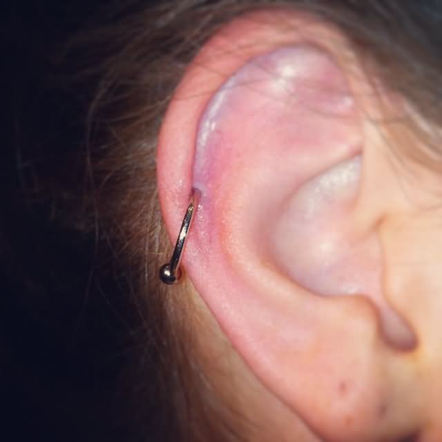 Cartilage Piercing With Silver Bead Ring
