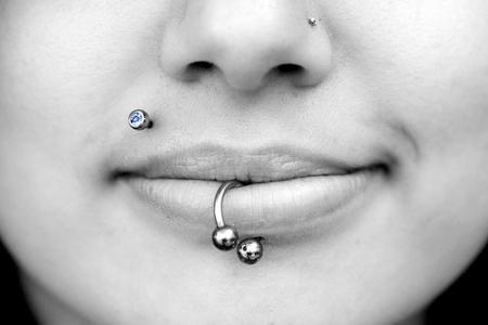 Center Labret Piercing With Circular Barbell And Right Monroe Lip Piercing
